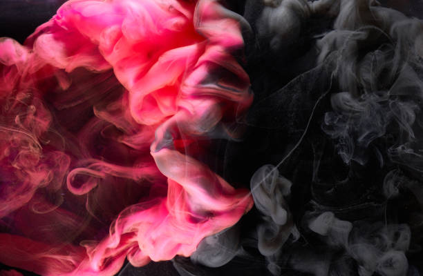 istock Red black pigment swirling ink abstract background, liquid smoke paint underwater 1350680332