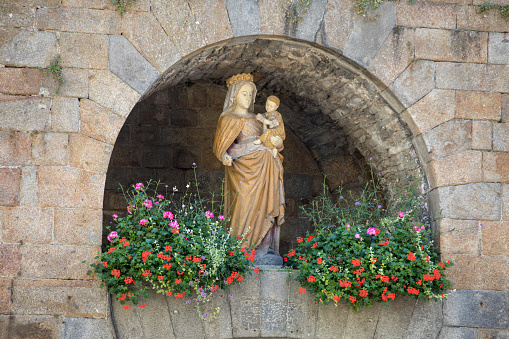 Sculpture of the Virgin Mary with Jesus in the old town of St Malo, Brittany. France