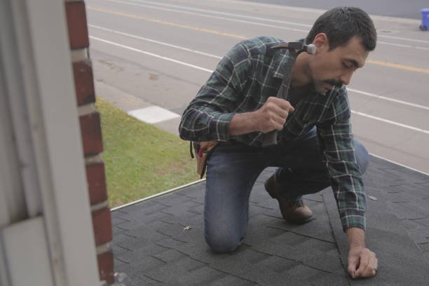 istock Roofer hammering residential roof 1350689369