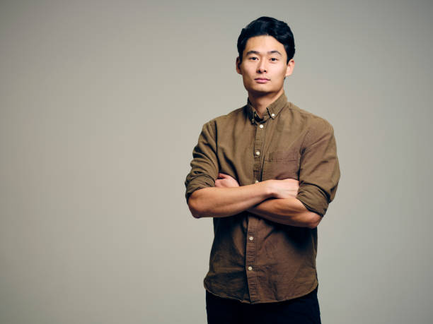 A headshot portrait of an Asian Korean man.