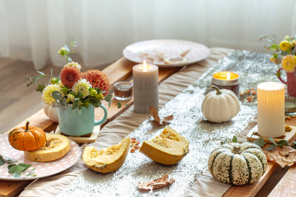 istock Festive table setting with pumpkins and chrysanthemum flowers. 1350690899