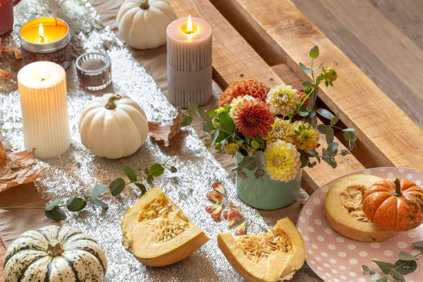 istock Festive table setting with pumpkins and chrysanthemum flowers. 1350690906
