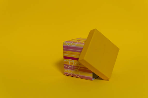 istock Gift boxes on the colored backgrounds, birthday gift, christmas present, with ribbon bow, valentine day surprise, birthday concept. Flat lay, top view. 1350691580