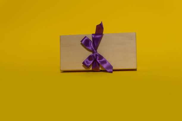 istock Gift boxes on the colored backgrounds, birthday gift, christmas present, with ribbon bow, valentine day surprise, birthday concept. Flat lay, top view. 1350692239