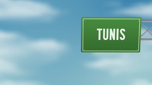 Tunis capital city of Tunisia road sign over the blue cloudy sky - Stock video