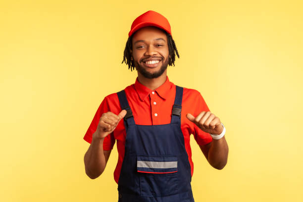 istock Worker looking at camera with proud expression, pointing at himself, satisfied of work done. 1350692564