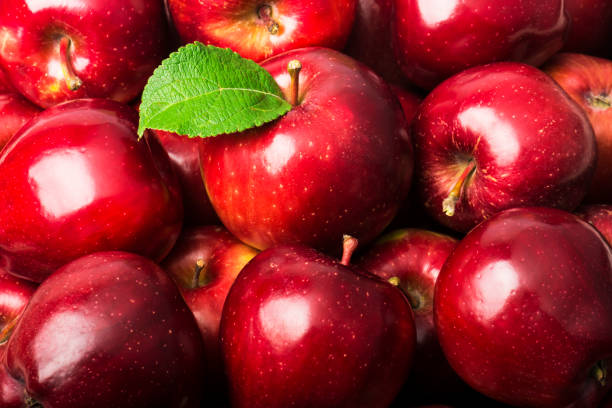 istock Background of red apples close up 1350696638
