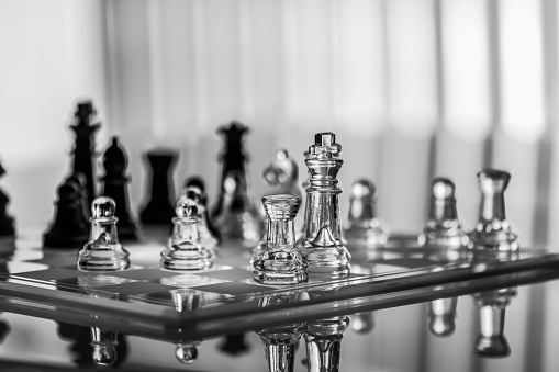 glass made chessboard on a black & white background