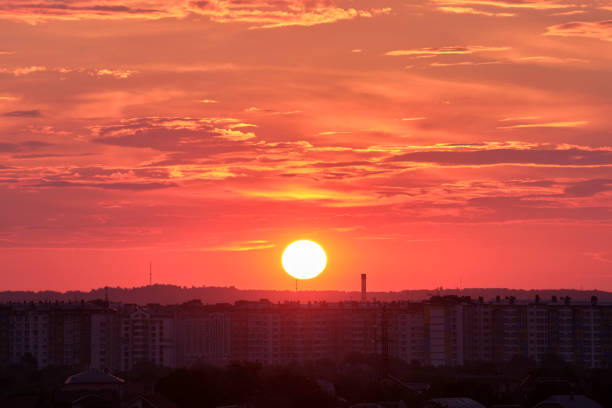 istock Colorful evening landscape with soft pastel coloured cloudscape over dark distant cityscape with watercolor tinted sunset sky. Abstract nature background 1350698301