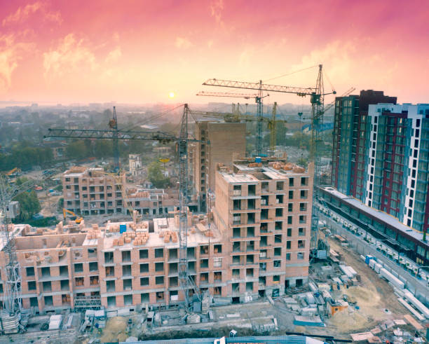 istock cranes over building a house 1350698527