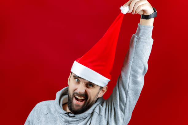 istock a man in a Santa Claus hat. 1350699235