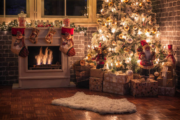 istock Decorated Christmas Tree Near Fireplace at Home 1350699591