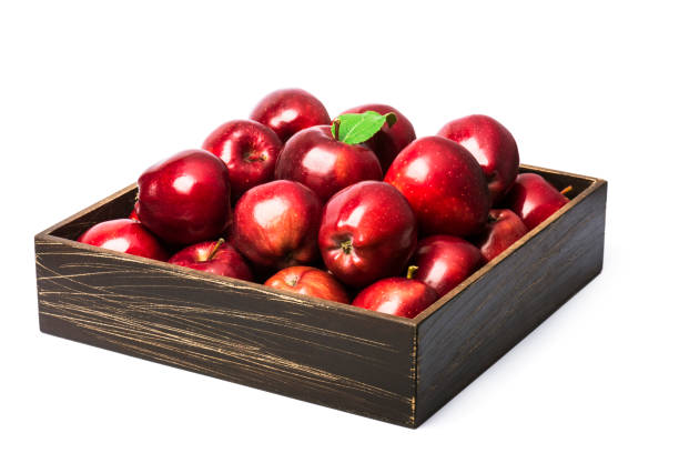 istock ripe red apples in a wooden box 1350699636