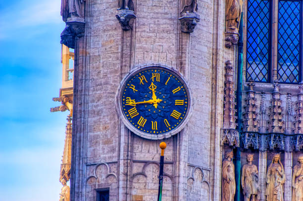 Brussels, Belgium, November 03 2018: Old tower clock at building located at central square in Brussels, Belgium.