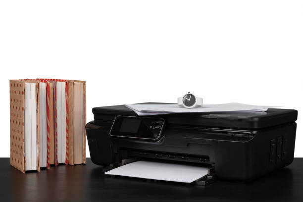 istock Working table with printer and stacked books on white abckground 1350699980