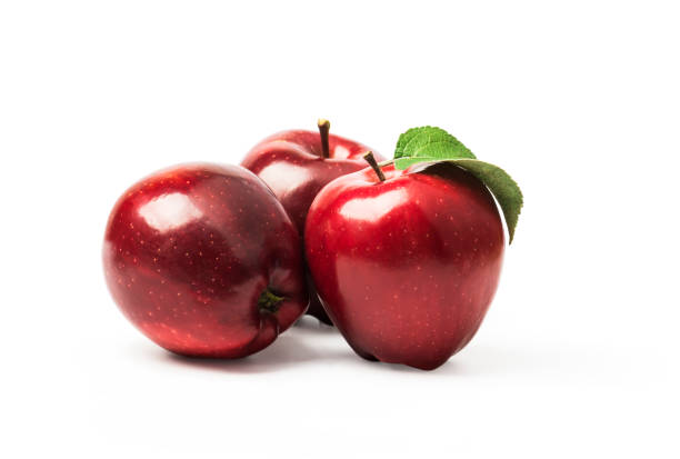 istock Red apples with leaves isolated on white 1350700754
