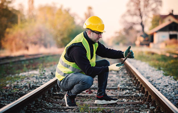 istock Railroad inspection. Technician found damage on the railway during the inspection. Transportation concept 1350700780