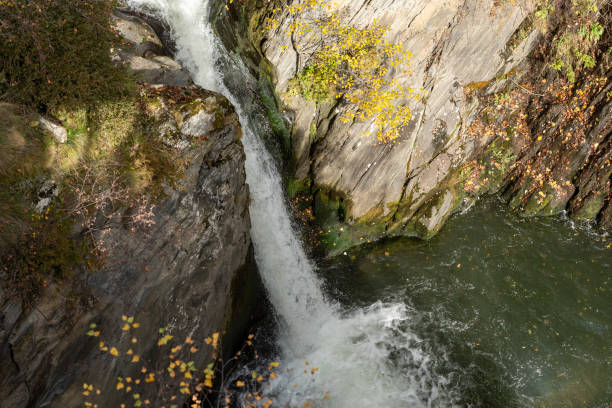 istock Waterfall in autumn landscapes in the forest. 1350702093