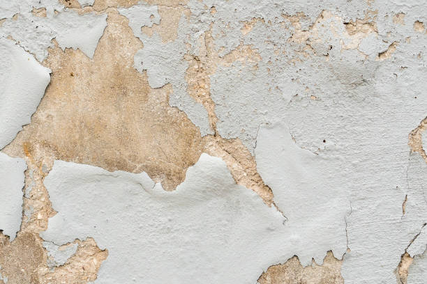 istock Old peeled wall paint. Abstract grunge background. 1350710473
