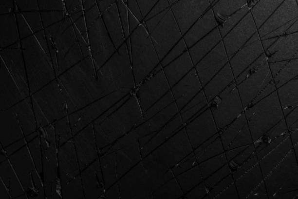 istock Old damaged black paper with scratches 1350710481