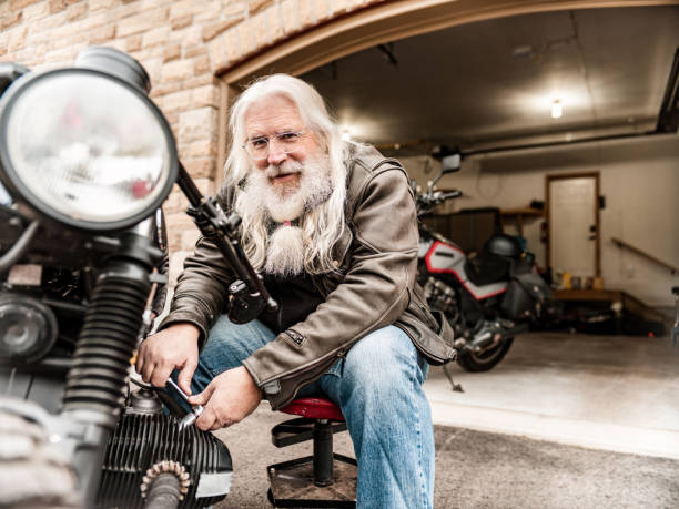 istock Senior man working on his motorcycle 1350712615