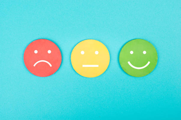Faces with different emotions, sad, happy, business rating, blue background stock photo