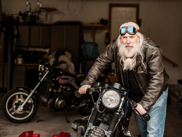 istock Senior man working on his motorcycle 1350713312