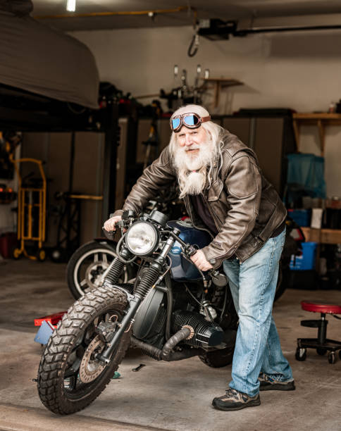 istock Senior man working on his motorcycle 1350713335