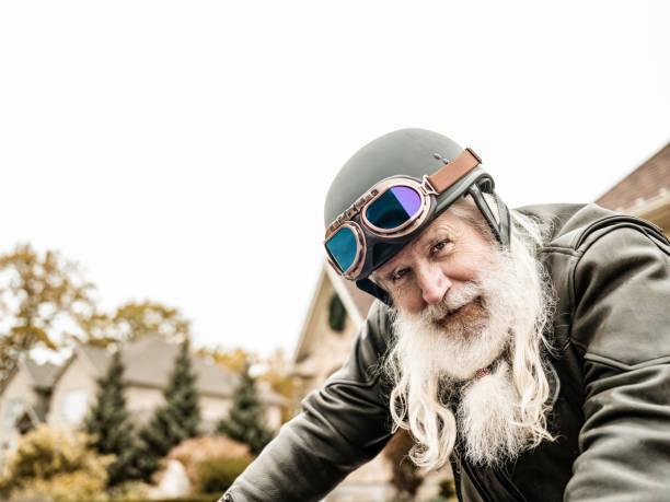 istock Senior man getting ready to ride his motorcycle 1350713497