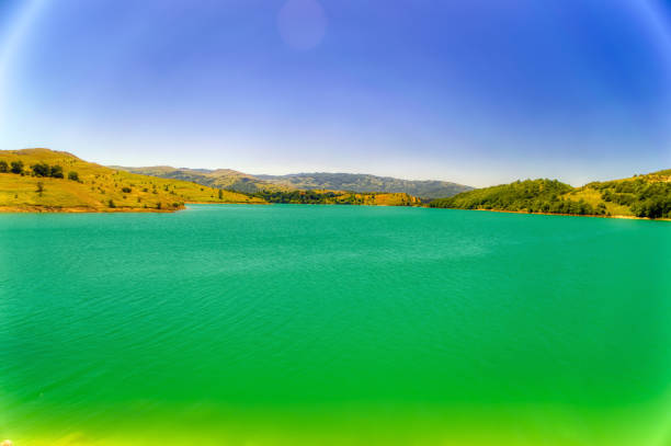 Mountain lake during sunny summer day.