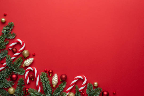 istock Christmas or New Year red background with fir decor 1350717367