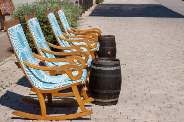 istock The beautiful beach front on the Island of Majorca in Spain showing deck chairs and beer barrel tables on the ocean front 1350719607