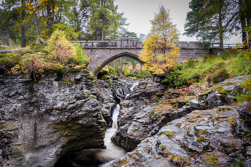 The stone bridge that goes over the rapids of the river Dee in the Cairngorms Mountains of Scotland