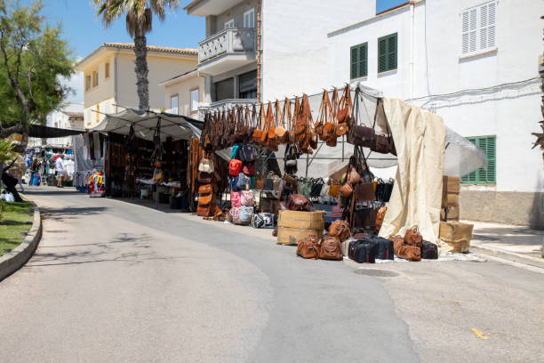A typical Spanish street market taken on the beautiful island of Majorca in Spain showing leather goods being sold on the street market stock photo