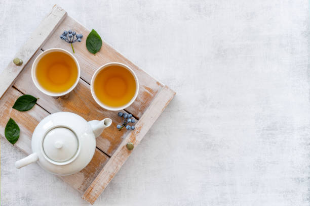 istock Asian tea set with white teapot and two cups, top view 1350720855
