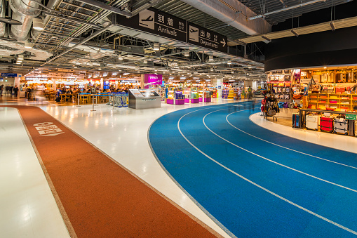tokyo, japan - december 06 2019: Suitcases store in the domestic terminal 3 of Narita International Airport designed as an indoor running track in a color-coded circuit for Tokyo 2020 Olympics Games.