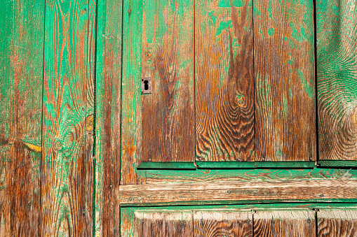 Weathered aged green door wood texture backdrop background