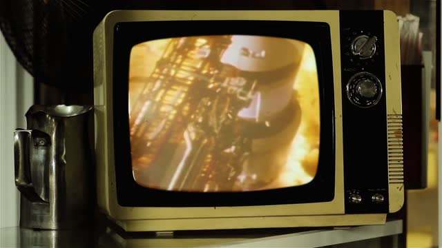 Color Footage of the 1969 Apollo 11 Launch on a Retro TV. Elements of this Video Furnished by NASA. 4K Resolution.