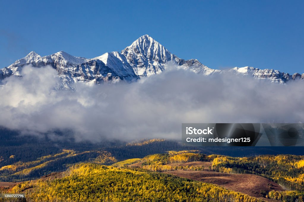 Wilson Peak with fresh snow and fall colors near Telluride, Colorado Wilson Peak and scenic autumn landscape with fresh snow and fall colors in the San Juan Mountains near Telluride, Colorado. Wilson Peak Stock Photo