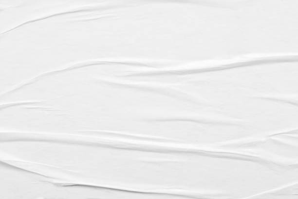 istock white crumpled and creased paper poster texture background 1350730528