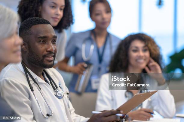 Diverse Medical Team Meeting Stock Photo - Download Image Now - Doctor, Medical Student, Nurse