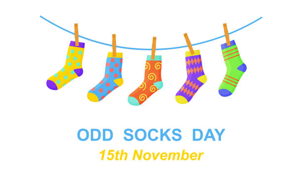 Odd socks day. Anti bullying week banner. Different colorful odd socks hanging on the rope. Vector cartoon illustration Odd socks day. Anti bullying week banner. Different colorful odd socks hanging on the rope. Vector cartoon illustration. sock stock illustrations