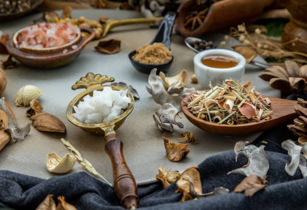 istock Various spices and herbs in rustic style with honey on balck background. 1350731998