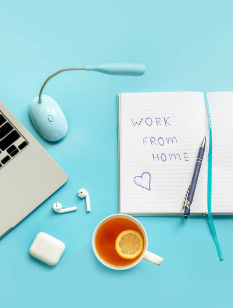 istock flatlay business, work from home, freelance, copywriting, top view laptop, notebook with work from home note and cup of tea on blue background 1350735994