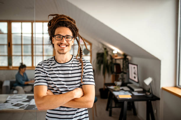 Portrait of young,cheerful graphic designer in studio