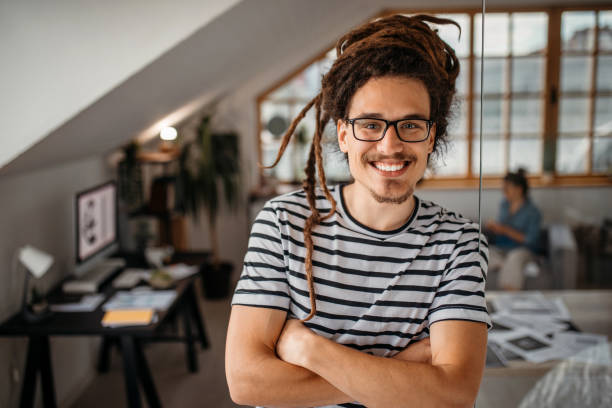 istock Portrait of young,cheerful graphic designer in studio 1350738282