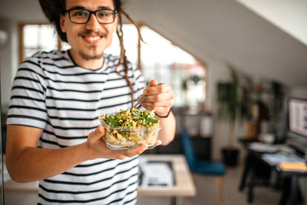 istock Eating healthy meal in the office 1350738318