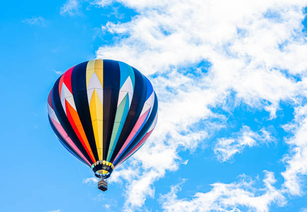 istock Colorful hot air balloon with blue sky background 1350746997