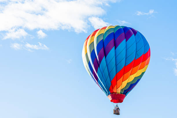 istock Colorful hot air balloon with blue sky background 1350747005
