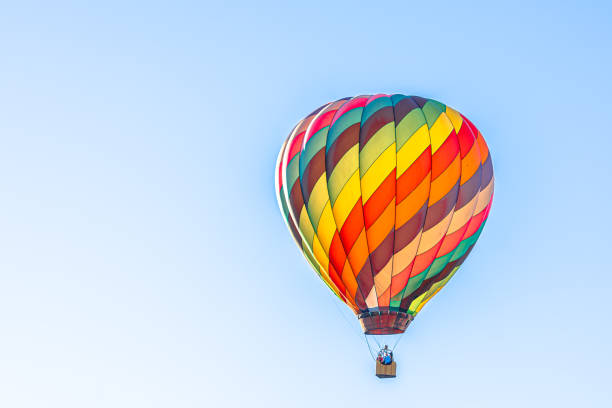 istock Colorful hot air balloon with blue sky background 1350747024